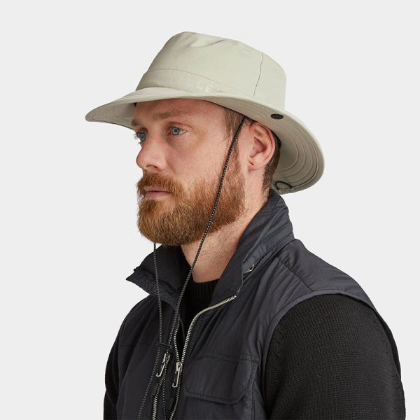 A man wearing a Rainproof Bucket Hat by Tilley Endurables